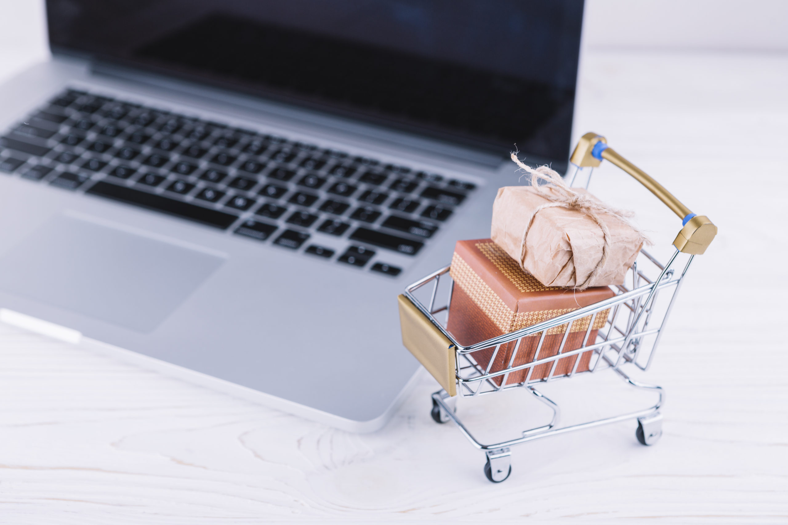 small-grocery-cart-with-gift-boxes-laptop